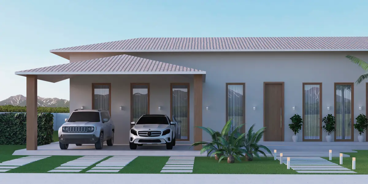 Casa Térrea com Varandas: Residência térrea com telhado aparente, varandas generosas, garagem coberta e área gourmet voltada ao jardim.